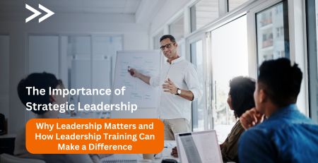 A group of diverse professionals in a meeting, with a leader guiding the discussion, symbolizing the power of strategic leadership in driving organizational success.